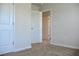 Bedroom with neutral walls and plush carpeting throughout the home at 678 Egrets Landing #63, Covington, GA 30014
