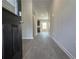 Inviting entryway with durable floors and a glimpse into the bright, open-concept living space at 678 Egrets Landing #63, Covington, GA 30014