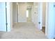 Hallway featuring neutral-toned walls and plush carpeting throughout the home at 678 Egrets Landing #63, Covington, GA 30014