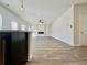 Open-concept living area featuring a modern fireplace, recessed lighting, and durable floors at 678 Egrets Landing #63, Covington, GA 30014
