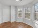 Bright bedroom with wood floors, two closets, and natural light from multiple windows at 135 Kimbell Farm Dr, Locust Grove, GA 30248