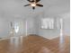 Open-concept living space with wood floors, vaulted ceiling, and breakfast bar at 135 Kimbell Farm Dr, Locust Grove, GA 30248