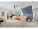 Finished attic space with sitting area, game table, and shelving at 2114 Castlewycke Ct, Marietta, GA 30068
