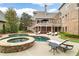 Enjoy a luxurious backyard with pool, spa, and lush landscaping, perfect for entertaining at 2114 Castlewycke Ct, Marietta, GA 30068