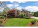 Beautiful backyard with lush green lawn and manicured landscaping, creating a private oasis at 2114 Castlewycke Ct, Marietta, GA 30068