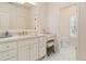 Bathroom with vanity, mirror, drawers, cabinets, stool and doorway leading to the toilet at 2114 Castlewycke Ct, Marietta, GA 30068