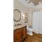 The vanity in this bathroom has an ornate wood finish, marble countertop and decorative mirror at 2114 Castlewycke Ct, Marietta, GA 30068