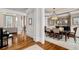 Elegant dining room with hardwood floors, wainscoting, and a stylish chandelier at 2114 Castlewycke Ct, Marietta, GA 30068