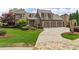 Spacious home with a three-car garage, complemented by a well-manicured lawn and beautiful landscaping at 2114 Castlewycke Ct, Marietta, GA 30068