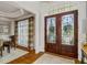 Elegant foyer featuring hardwood floors, detailed trim, and a stunning front door at 2114 Castlewycke Ct, Marietta, GA 30068