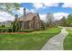 Beautiful two-story home with well-manicured lawn and mature trees at 2114 Castlewycke Ct, Marietta, GA 30068