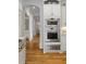 Modern kitchen with stainless steel microwave, oven, and hardwood floors at 2114 Castlewycke Ct, Marietta, GA 30068