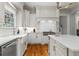 Spacious kitchen featuring marble countertops, stainless steel appliances, and custom cabinets at 2114 Castlewycke Ct, Marietta, GA 30068