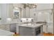 Well-lit kitchen featuring an island, farmhouse sink, and modern appliances at 2114 Castlewycke Ct, Marietta, GA 30068