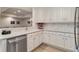 Bright kitchen with white cabinets, modern countertops and stainless steel appliances at 2114 Castlewycke Ct, Marietta, GA 30068