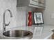 Kitchen with marble countertops, custom sink, and mosaic backsplash at 2114 Castlewycke Ct, Marietta, GA 30068