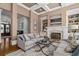 Cozy living room featuring a fireplace, coffered ceilings, and comfortable seating at 2114 Castlewycke Ct, Marietta, GA 30068