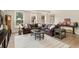 Spacious living room with a large leather sectional, patterned rug, and natural light at 2114 Castlewycke Ct, Marietta, GA 30068
