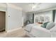 This bedroom has a ceiling fan and a big window with a bench and plantation shutters at 2114 Castlewycke Ct, Marietta, GA 30068