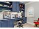 This office has a large built in desk with storage and lighting to provide a comfortable work space at 2114 Castlewycke Ct, Marietta, GA 30068