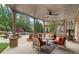 Inviting outdoor patio with lounge seating, fire feature, and view of the backyard pool at 2114 Castlewycke Ct, Marietta, GA 30068