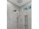 Bright shower with tiled walls, modern fixtures, and a window for natural light at 2114 Castlewycke Ct, Marietta, GA 30068