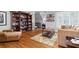 Sitting room featuring hardwood floors, comfortable furniture, shelving, and natural light at 2114 Castlewycke Ct, Marietta, GA 30068