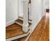Hardwood stairs and floors with white trim create a welcoming transition between levels at 2114 Castlewycke Ct, Marietta, GA 30068