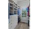 Organized walk-in closet with custom shelving and drawers for clothes and accessories at 2114 Castlewycke Ct, Marietta, GA 30068