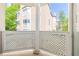 View from private balcony with white lattice overlooking surrounding buildings at 244 13Th Ne St # 310, Atlanta, GA 30309