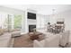 Bright living room featuring a fireplace, modern furnishings, and large windows at 244 13Th Ne St # 310, Atlanta, GA 30309