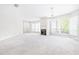 Open living room with fireplace and large windows at 244 13Th Ne St # 310, Atlanta, GA 30309