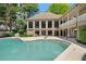 Beautiful backyard pool with a patio and a view of the home's expansive windows at 244 13Th Ne St # 310, Atlanta, GA 30309