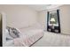 Cozy bedroom features a bed, a window, and soft carpet at 2831 Pine Log Way, Buford, GA 30519