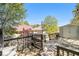View of a backyard deck perfect for entertaining, with trees providing shade, along with an outdoor storage shed at 4312 Defoors Farm Trl, Powder Springs, GA 30127