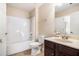 Bathroom with a tub/shower, neutral vanity, and a toilet at 4312 Defoors Farm Trl, Powder Springs, GA 30127