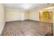 Spacious living room with light wood floors and access to other living areas at 4312 Defoors Farm Trl, Powder Springs, GA 30127