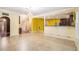 Spacious living area with tile floors, offering ample room for entertaining with open access to the kitchen at 4312 Defoors Farm Trl, Powder Springs, GA 30127