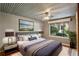 A beautifully staged bedroom with unique ceiling, large window and comforting design at 702 Argonne Ne Ave # 1, Atlanta, GA 30308