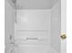 Bright, all-white bathtub and shower combination with updated fixtures at 1112 Autumn Glen Way, Dacula, GA 30019