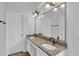 Bathroom featuring double vanity with granite countertop and framed mirror at 1112 Autumn Glen Way, Dacula, GA 30019