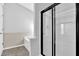 Shower with black frame, next to tiled tub area at 1112 Autumn Glen Way, Dacula, GA 30019