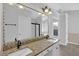 Double vanity in bathroom with granite countertops and decorative lighting at 1112 Autumn Glen Way, Dacula, GA 30019