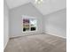 Light filled bedroom with large window, neutral walls, and ceiling fan at 1112 Autumn Glen Way, Dacula, GA 30019