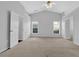 Large bedroom with vaulted ceiling, carpet and ensuite bathroom at 1112 Autumn Glen Way, Dacula, GA 30019