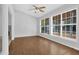 Bright dining room with hardwood floors and large windows, ideal for enjoying meals at 1112 Autumn Glen Way, Dacula, GA 30019