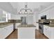 Well-equipped kitchen with granite countertops, stainless appliances, and a functional kitchen island at 1112 Autumn Glen Way, Dacula, GA 30019