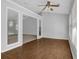 Open room featuring hardwood floors and large windows at 1112 Autumn Glen Way, Dacula, GA 30019
