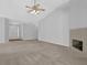 Spacious living room features a fireplace, high ceilings, and neutral carpet at 1112 Autumn Glen Way, Dacula, GA 30019