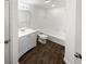 This bathroom offers wood-look floors, a single vanity, and a shower-tub combination at 2252 Carefree Cir # 3, Marietta, GA 30062